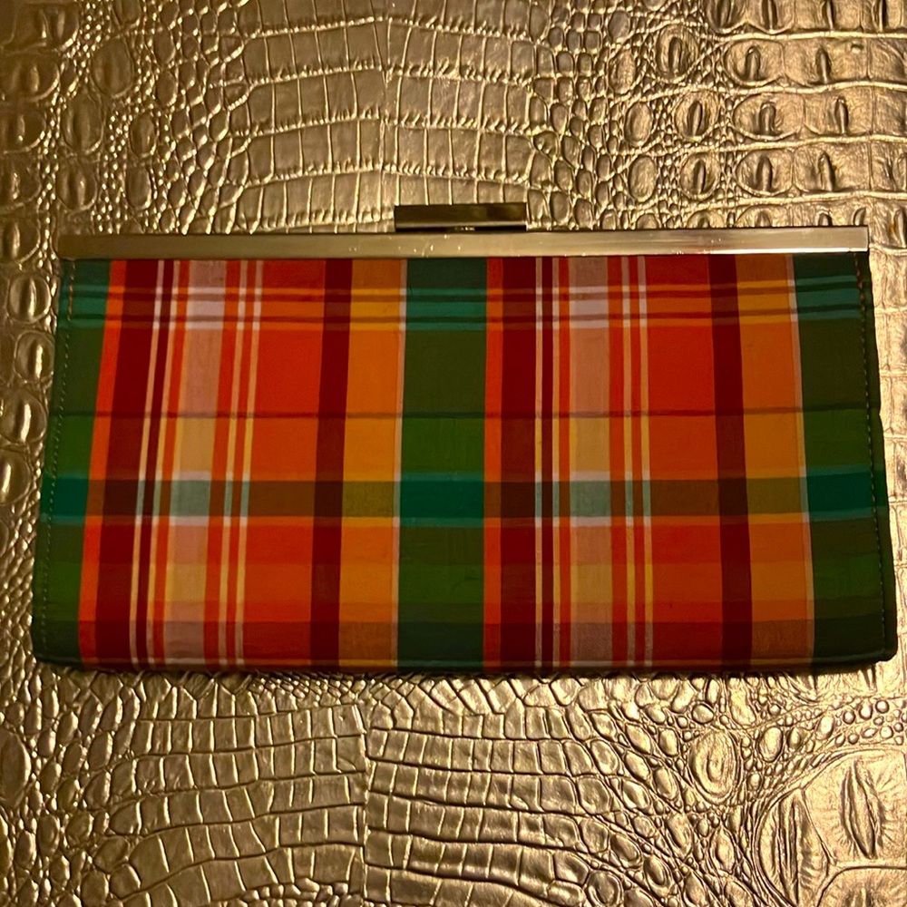 Cute clutch with a plaid print.